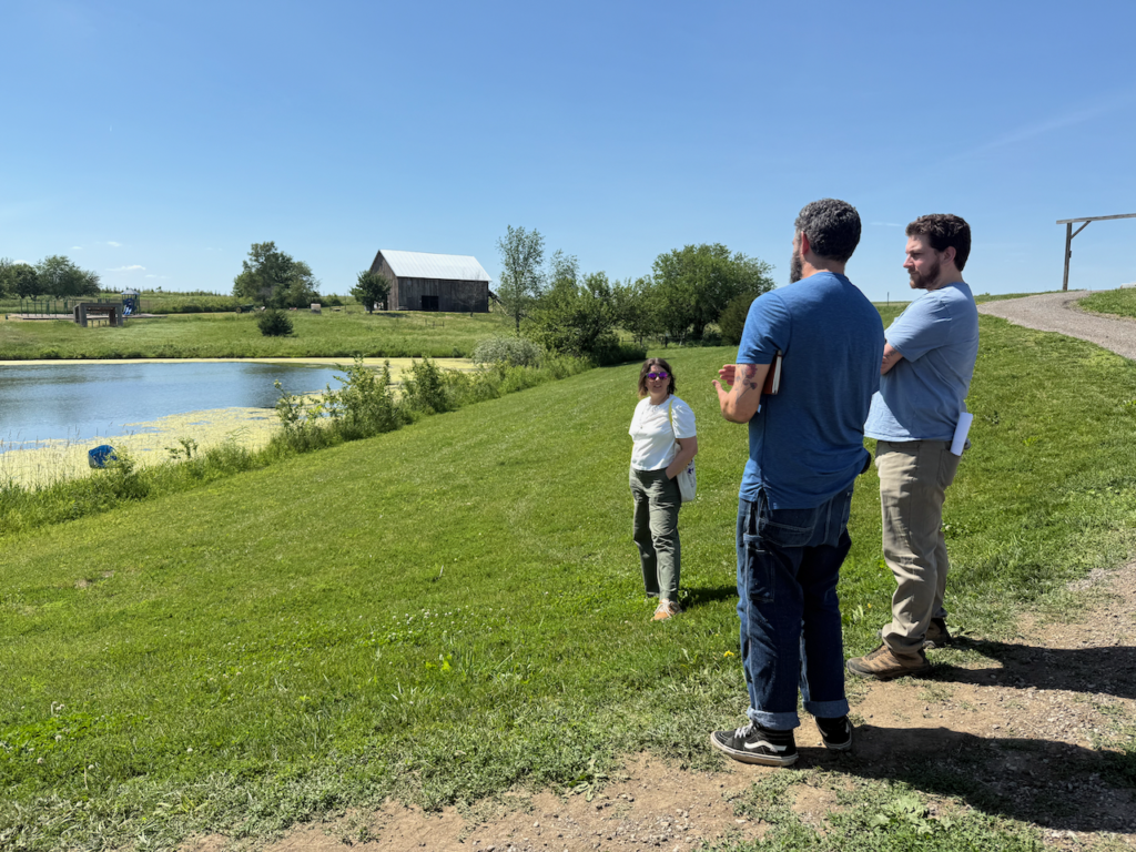 Artists Emily Newman and Edward Kelley of Parts Per Million Collective visit Wilson's co-owner Jacob Goering at Wilson's Orchard & Farm in June.